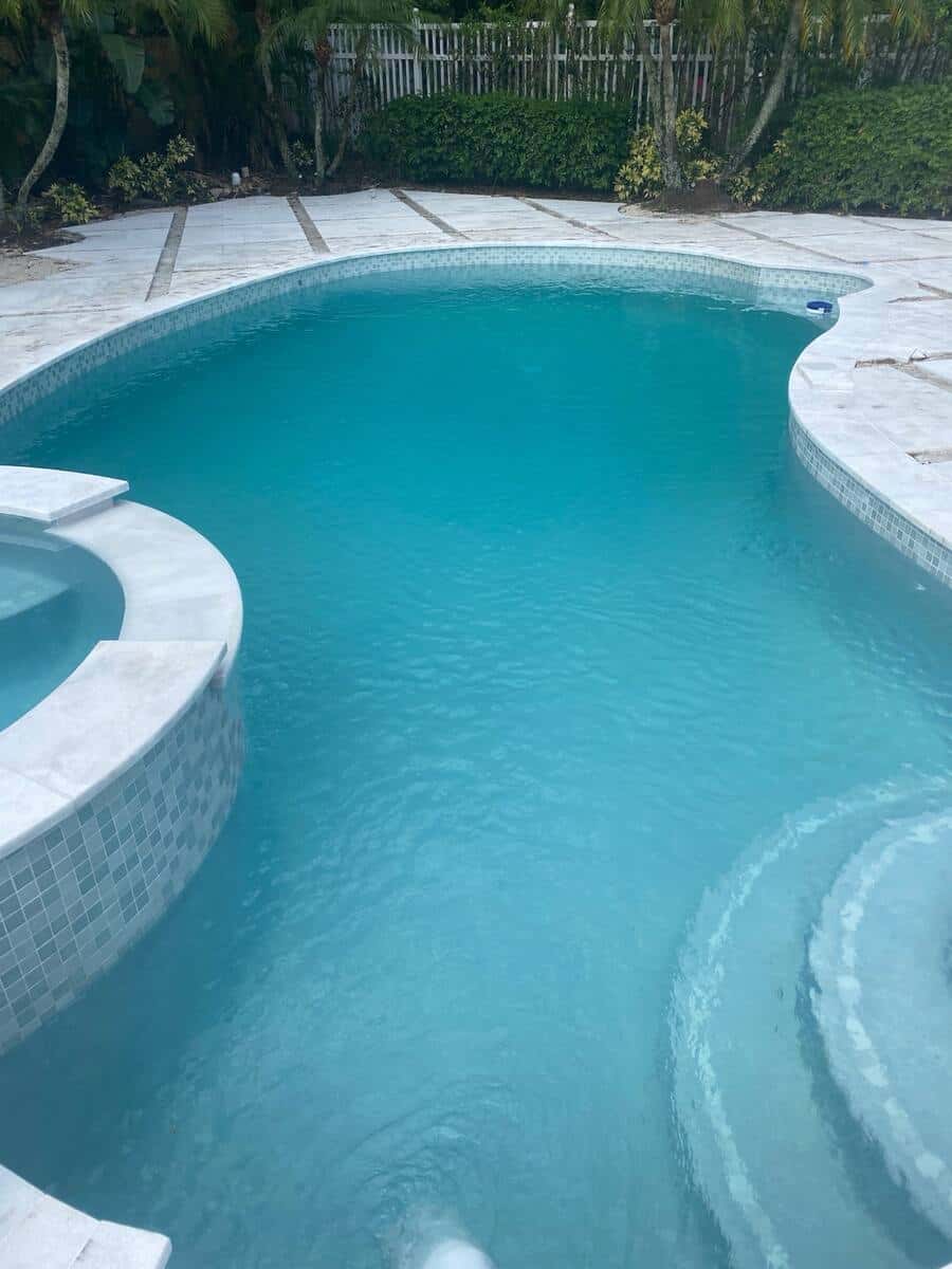 Crystal-clear pool after recovery — East Boca, residential
