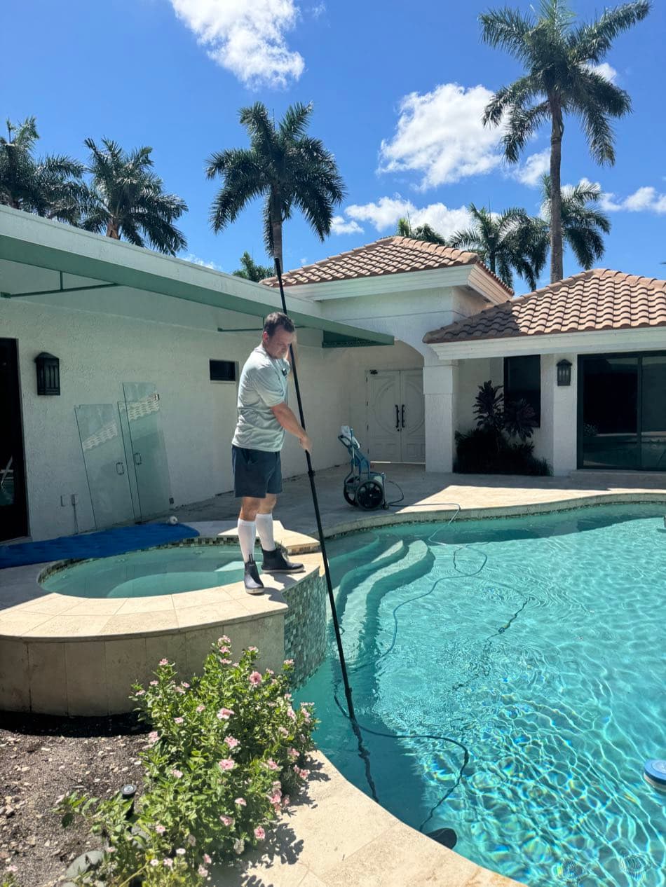 Florida's Best Pools technician servicing a residential pool in Boca Raton